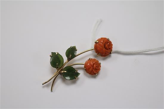 A gold, carved coral and jade rose brooch, 50mm.